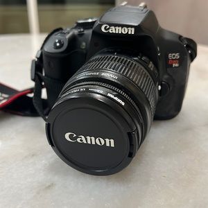 Canon Rebel T4i with 58 mm lens and strap